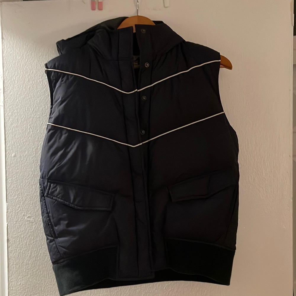 Eastern Mountain Sports navy puffer vest with hood.